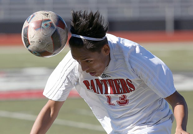 A Vista (Calif.) player connects on a header during a junior varsity game against Westview.