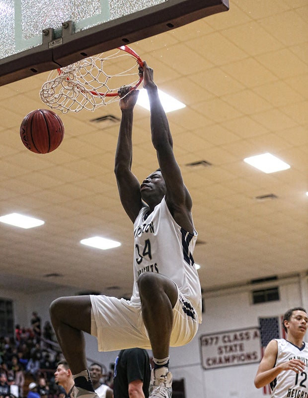 Hamilton Heights Christian Academy (Tenn.) center Kaosi Ezeagu shatters the backboard on a monster dunk against Southwest Christian Academy during the Hotbed Classic at Memorial Gym in New Albany (Miss.).