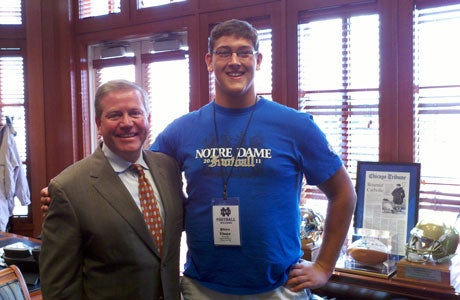 Steven Elmer of Midland is already making famous friends at Notre Dame, like head coach Brian Kelly.