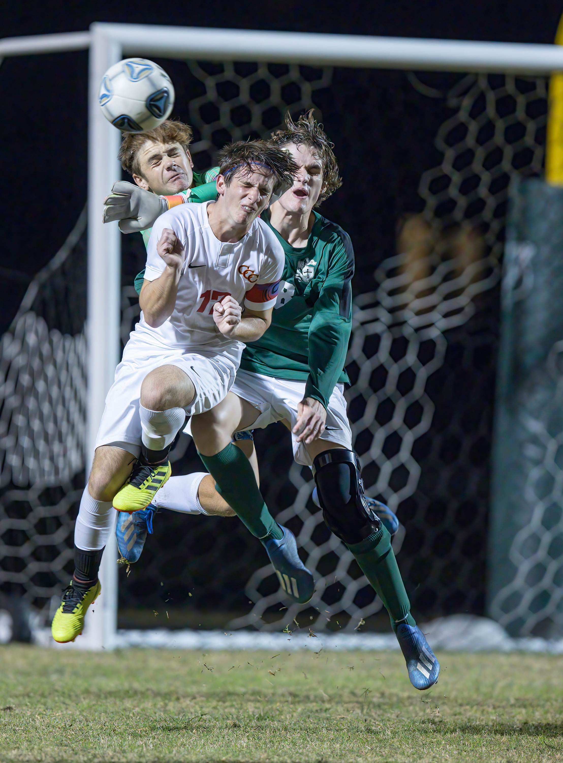 Clearwater Central Catholic defenders Vinny Minutolo and Ashton Carboni battle for a ball against Tampa Catholic's Trenton Charboneau.