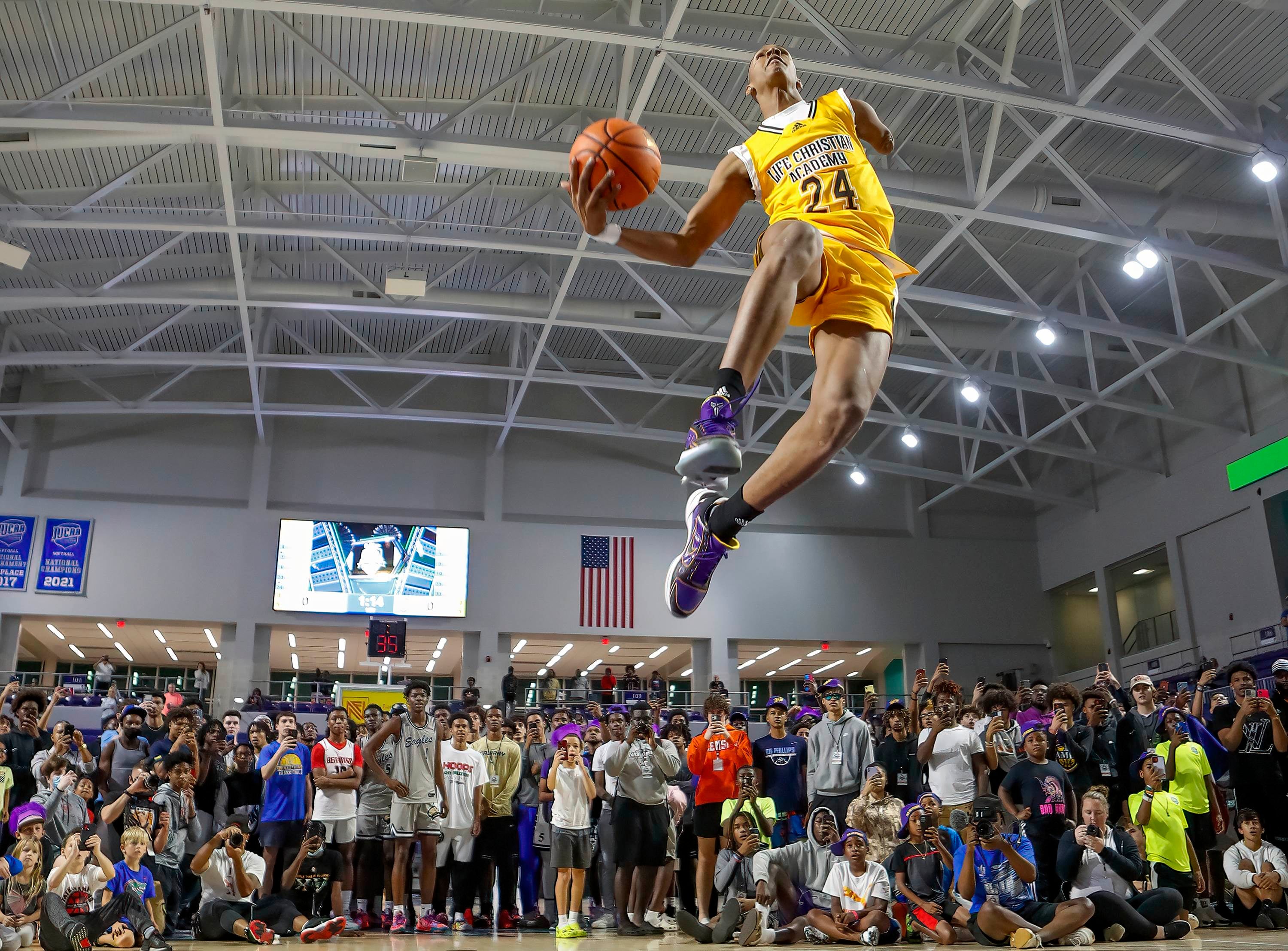 Life Christian Academy's Hansel Emmanuel soars for a flush in the City of Palms dunk contest. The basketball phenom, who lost his left arm in an accident as a child, had all eyes on him as he scored a perfect 50 on this dunk.