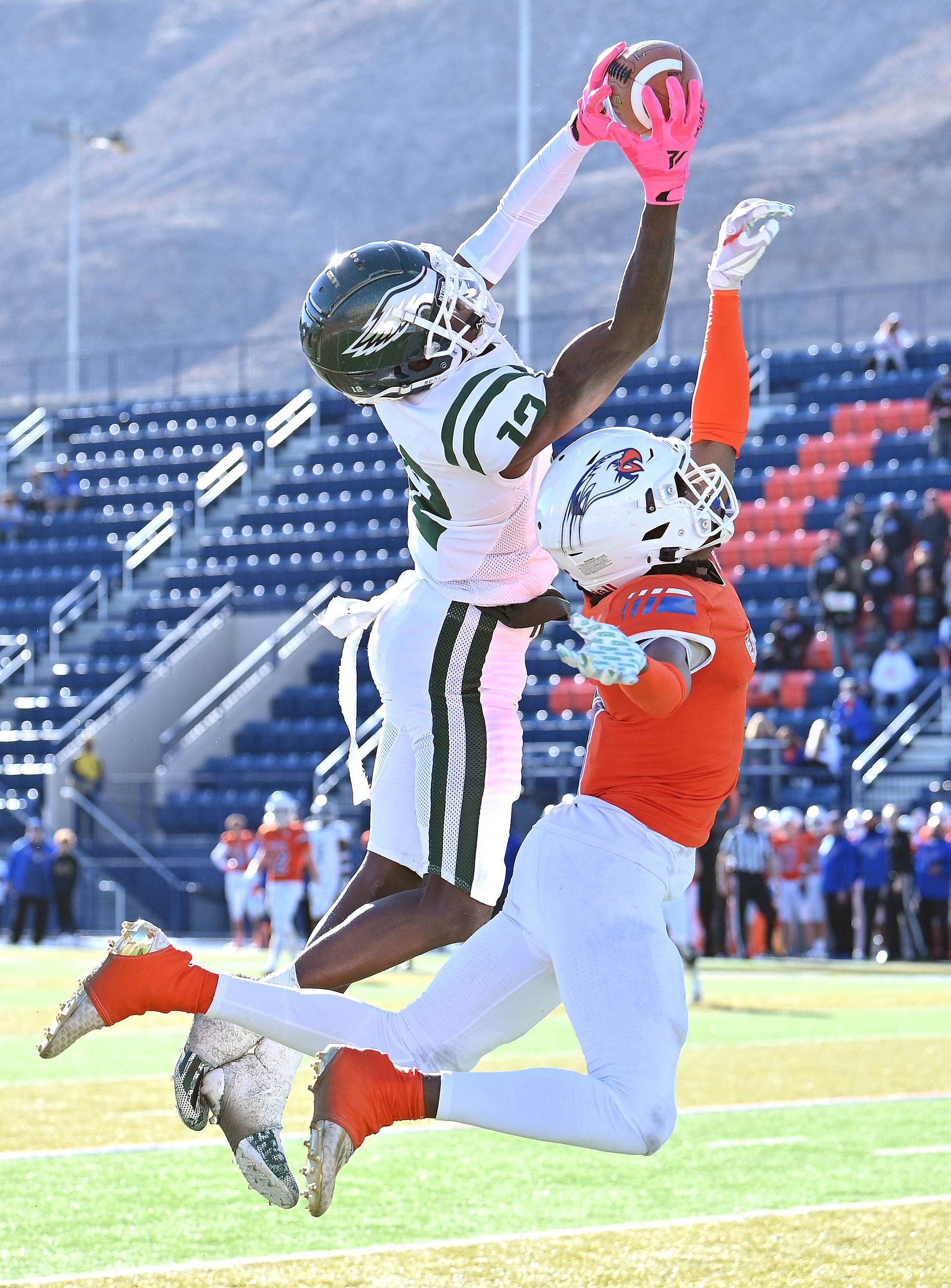 Collins Hill receiver Travis Hill goes up for an amazing 50-yard touchdown catch against Graham-Kapowsin during a GEICO State Champions Bowl Series game from Las Vegas. 