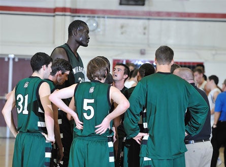 Ndiaye towers over his teammates at Brethren Christian in Huntington Beach, Calif.