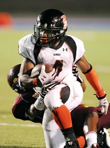 Dunbar running back Olu Izegwire.