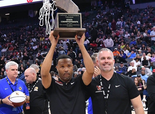 Etiwanda coach Stan Delus hoists the CIF Open Division trophy after his squad beat No. 1 Archbishop Mitty 60-48 on Saturday. (Photo: David Steutel)