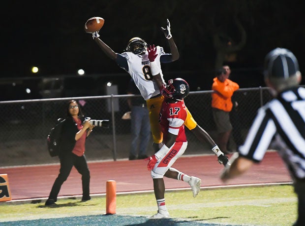 St. Thomas Aquinas receiver Teriq Phillips goes up high but can't come down with a potential touchdown grab.