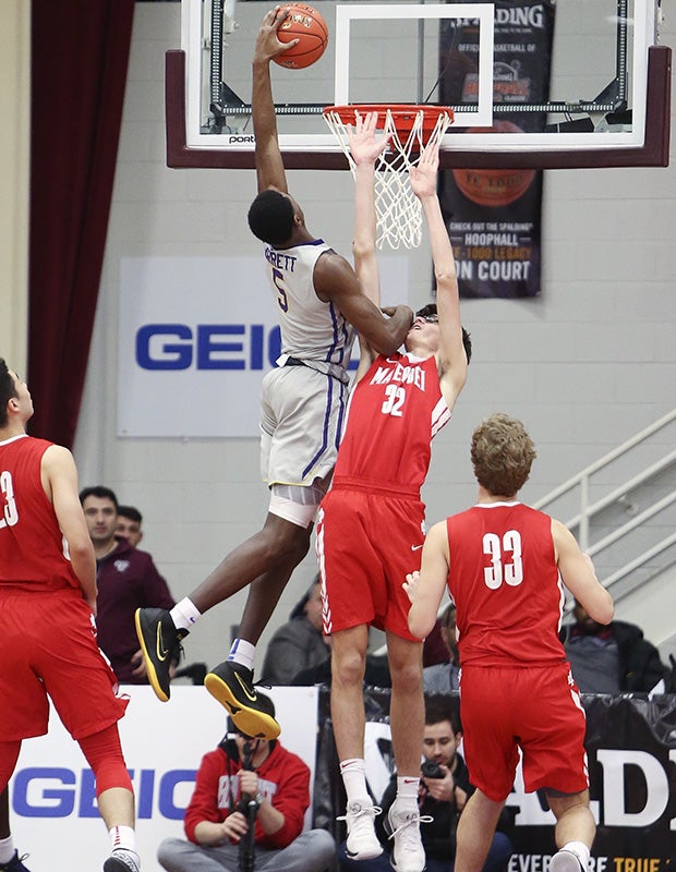 Montverde Academy (Fla.) forward R.J. Barrett dunks over Mater Dei's (Calif.) Wilhelm Breidenbach during the Spalding Hoophall Classic.