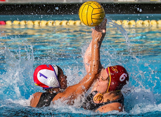 Righetti (Calif.) keeper Sophia Reyes (left) comes out of goal to defend on a shot by a La Serna player during the Bonita Tournament.