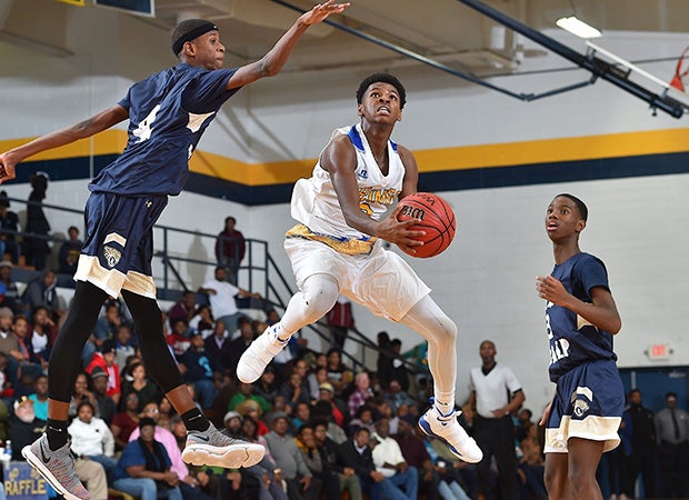 Plymouth (N.C.) senior Ta'Quan White soars for a layup against Rocky Mount Preparatory in the title game of the News Herald Holiday Classic.