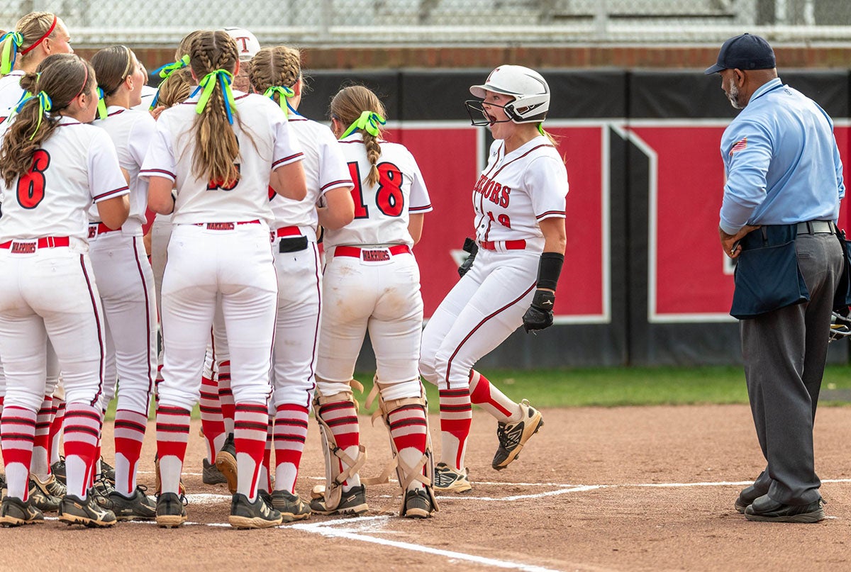 Blakely Davis of Thompson celebrates with teammates after hitting a home run against Tuscaloosa County earlier this season. Davis is also a power hitter in the classroom, earning valedictorian honors for the school. (PHOTO: Travis Kirkland) 