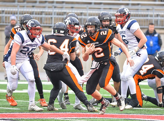 Minster quarterback Jared Huelsman ran for 53 yards and a touchdown on 14 carries.