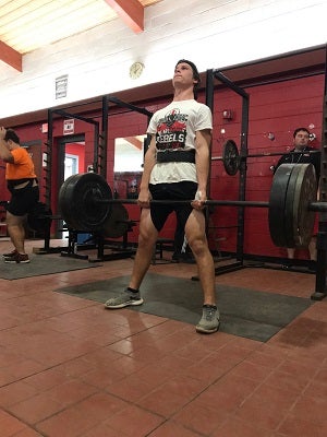 In addition to track and field and football, Lee
competes in powerlifting for his school.