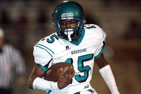 Woodside's Donnell Lewis is running here, but he connected on a 60-yard touchdown pass to D.J. Miller for the game's first touchdown. 