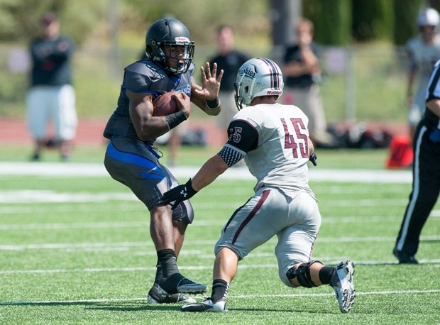 Hamilton's Derek Andersen closes in on an Eastlake ballcarrier Saturday at the Brothers in Arms Classic.