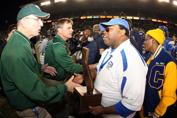 De La Salle and Crenshaw coaches and administrators offer congratulations after a clean, hard-fought contest. 