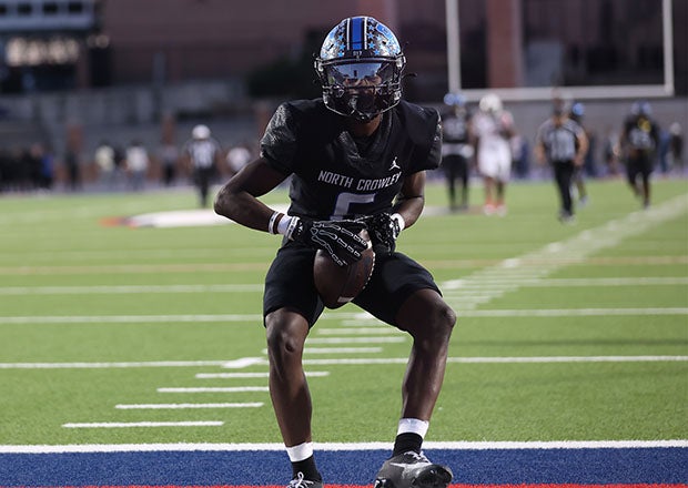 North Crowley wide receiver Quentin Gibson celebrates one of his two touchdown receptions on the day. (Photo: Michael Horbovetz)