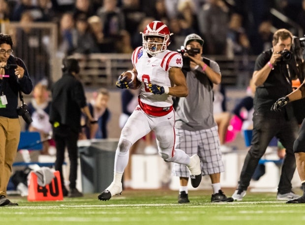 Amon-Ra St. Brown heads up the field last week against Trinity League rival St. John Bosco.