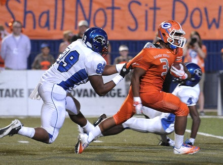 Not many defensive lineman can chase down Shaq Powell but Armwood's Allen Covington did here, illustrating the Hawks' victory.