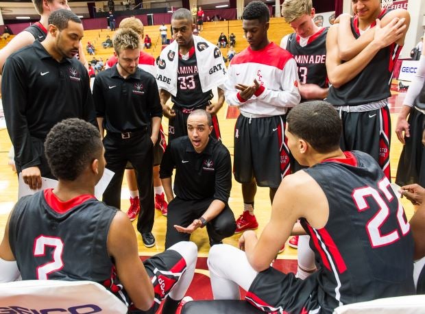 Head coach Frank Bennett (center) and No. 18 Chaminade are through to the round of 16 in Missouri's Class 5 state tournament.