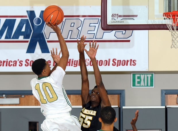 Ke'jhan Feagin goes over the Wenonah defense to make the game-winning shot in Long Beach Poly's 90-89 MaxPreps Holiday Classic quarterfinal victory over Wenonah late Friday night.