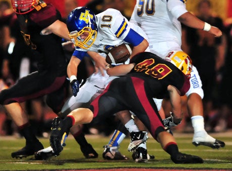 Mission Viejo, led here by linebacker Daniel Antonson (49), held the high powered El Toro attack to 40 points below its season average in a 49-7 romp Friday night.