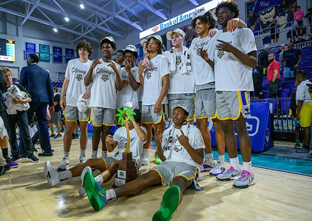 Montverde Academy players celebrate after winning their third game in three days to capture the City of Palms Classic. (Photo: Eugene Alonzo)