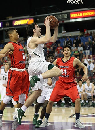 Point guard Colby Orr scores the game-tying basket
on this layup in the final seconds and was fouled.