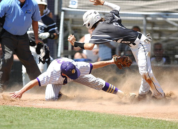 A South Beauregard (La.) player attempts to tag a Kaplan player at home plate during a LHSAA 3A playoff game.