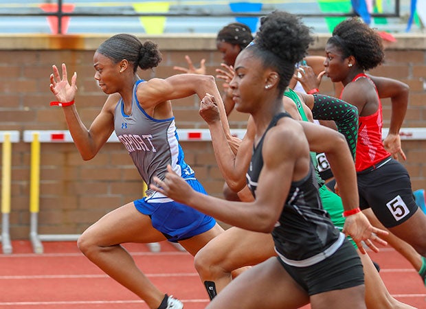 Athletes compete in the girls 100 meters event during the Bojangles Track and Field Classic.