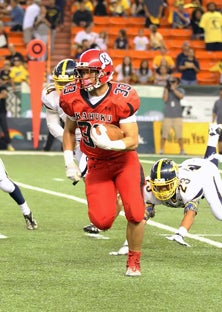 Aofaga Wily (33) is off the races
as he was much of Friday's win,
when he rushed for 188 yards
and three touchdowns.