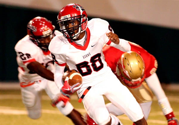 Deion Sanders Jr. looks for daylight during a 47-32 Cedar Hill win over South Grand Prairie this past season.