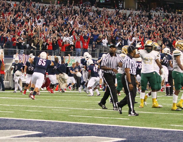 Allen players and fans celebrate the playoff victory as the game ends at AT&T Stadium on Saturday.