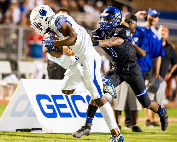 Receiver Brian Hightower of IMG Academy makes a catch along the sidelines.