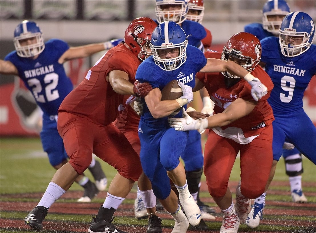 Bradon Wissler of Bingham grinds out yardage against Kahuku on Saturday night at the Polynesian Football Classic in Las Vegas.