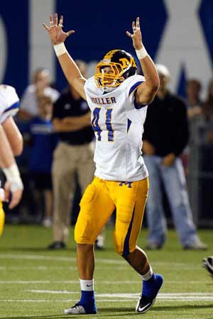 Moeller senior Jesse Hayes signals TD in second half.