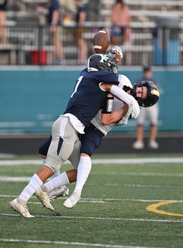 Valley Forge linebacker Shane Warden sacks North Ridgeville quarterback Brendan Watchorn.