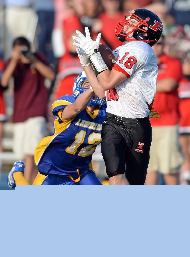 Sean Moran of Lawrence (Cedarhurst, N.Y.) sells out as a Plainedge (Massapequa, N.Y.) player makes the catch.