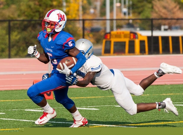 Cam Phillips of DeMatha (Hyattsville, Md.) continues to churn as Marquis Rowe of Bishop O'Connell (Arlington, Va.) hangs on.