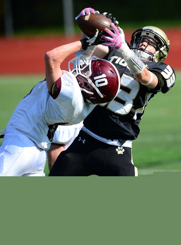 Players from North Haven (Conn.) and Hand (Madison, Conn.) battle for a pass in a JV game.