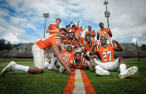 Head coach Josh Niblett and several top players ham it up during a recent photo shoot.