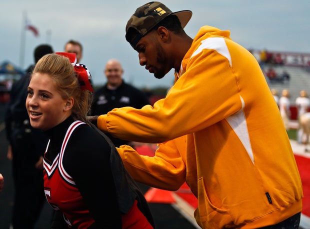 Paul George autographs a T-shirt for one of the Center Grove cheerleaders.