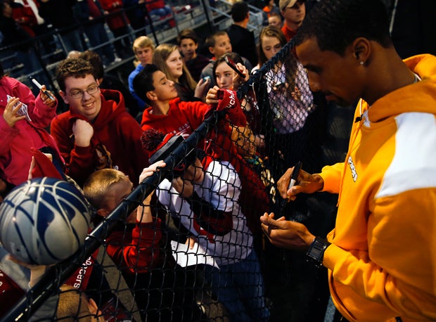 Indiana Pacers star George Hill signs autographs at the Center Grove High football game.