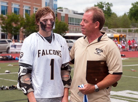 John Distler, right, with his 2013 captain, Liam Rooney, following last season's CIAC Class M championship game.