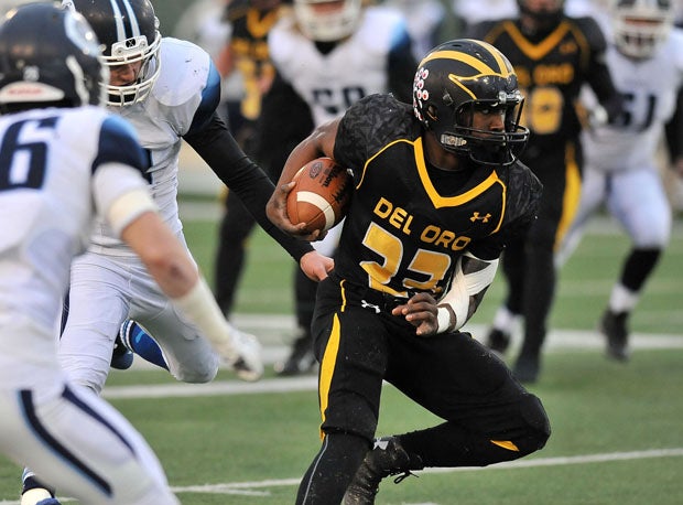 Cam Davis, shown here on a first-half carry, had touchdown runs of 7 and 48 yards for Del Oro.