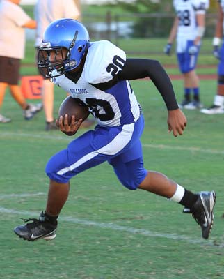 Pollard carries during warm-ups last Saturday.