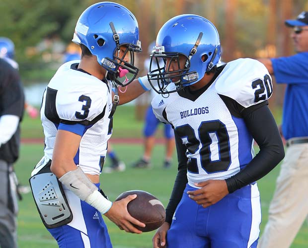 Teammate Jamie Jarquin instructs Pollard before last Saturday night's game.
