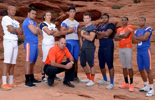 With Red Rock Canyon National Conservation Area as the backdrop, Bishop Gorman head coach Tony Sanchez gathers with some of his top players for the 2014 season.
