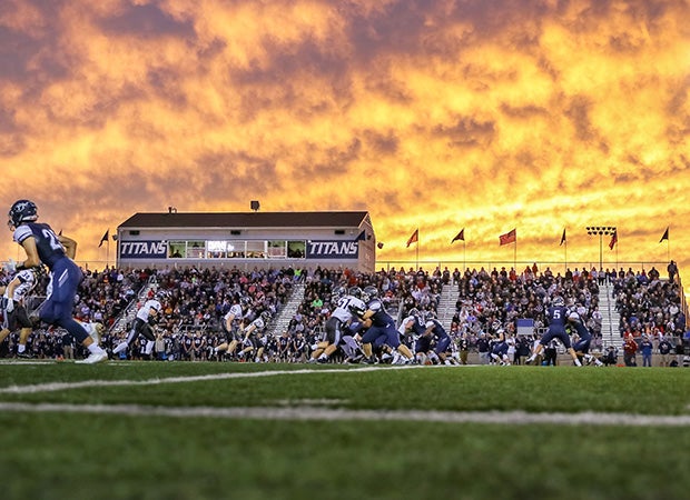 A fiery Missouri sky is the backdrop for the battle between host Lee's Summit West and Staley.