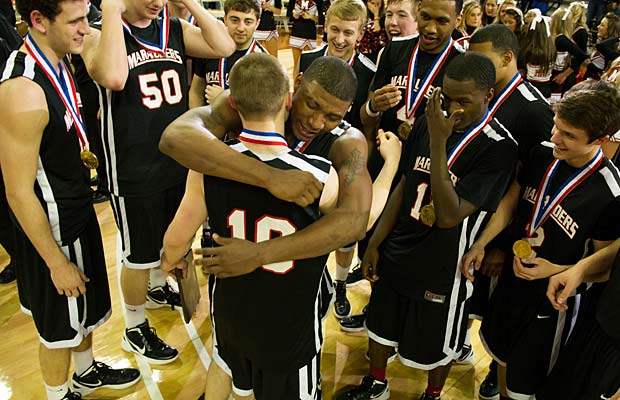 Phil Forte and Marcus Smart embrace after winning the 5A Texas state championship. They are now teammates at Oklahoma State.
