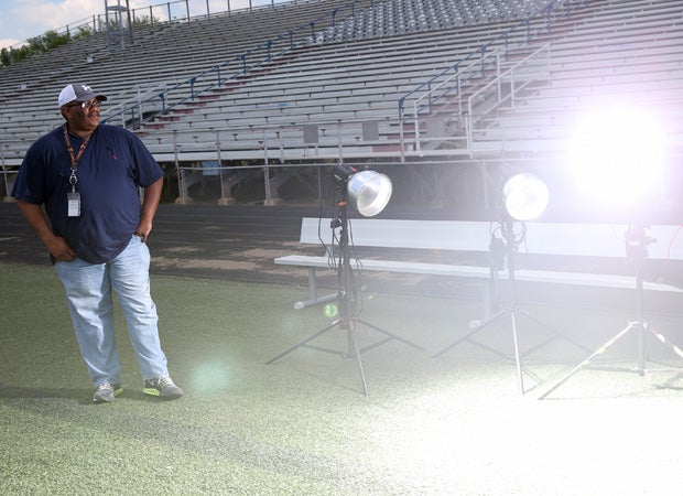 Photographer Fred Brooks looks on as Randy Sartin test fires one of his strobes while setting up for the photo shoot at South Panola.